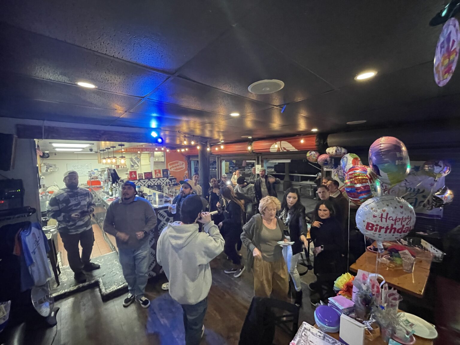 A birthday party with balloons and karaoke at a Project Barley event space